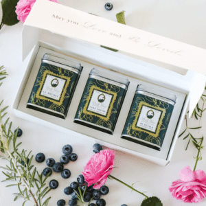 Three premium loose leaf teas in green tea caddies inside an elegant gift box