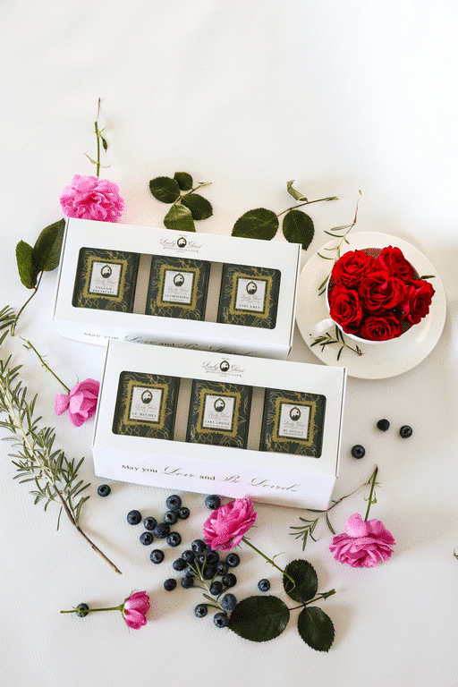Premium loose leaf teas in trio gift boxes surrounded with roses