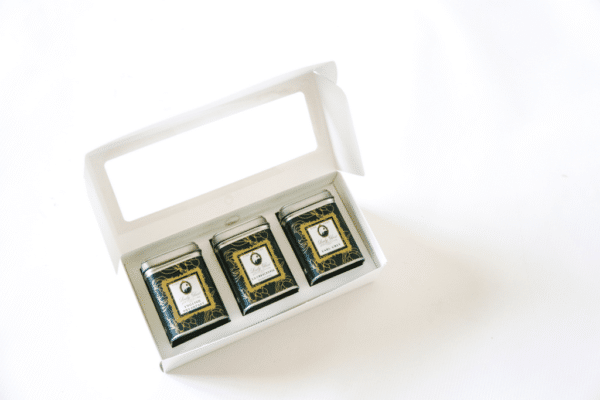 Three premium loose leaf teas in green tea caddies inside an elegant gift box